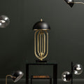 Black Open-Frame Table Lamp with Gold Swivel Joint