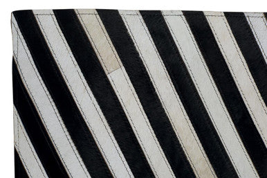 Small Black and White Hair on Leather Rug