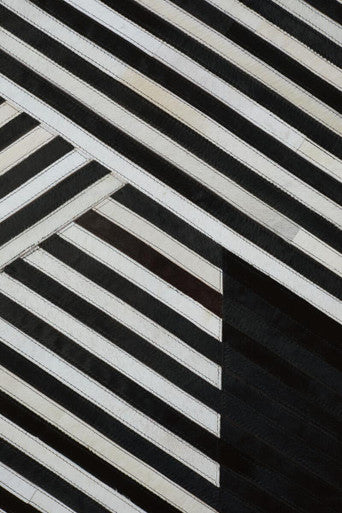 Small Black and White Hair on Leather Rug