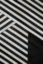 Small Black and White Hair on Leather Rug