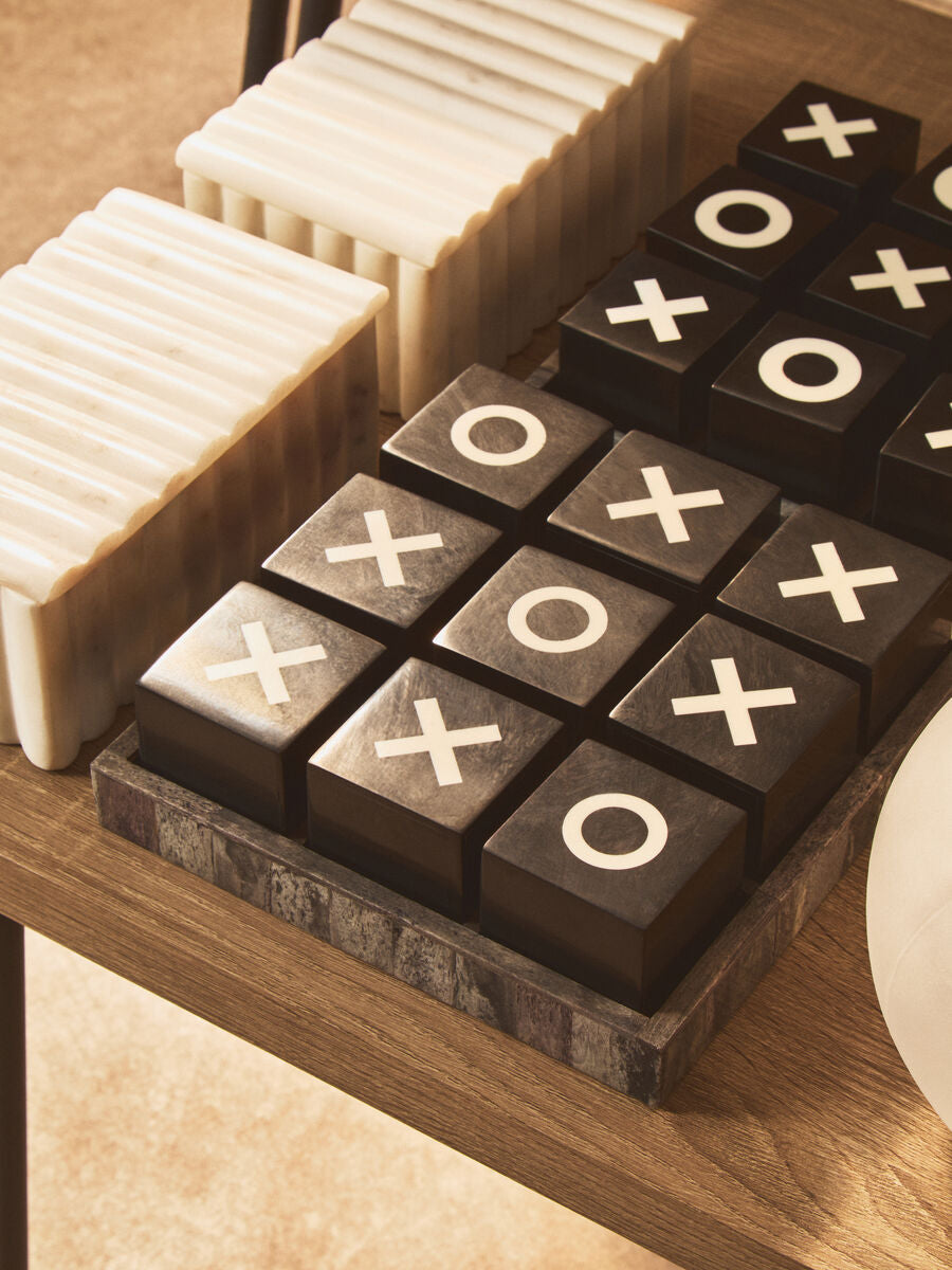 Black and White Noughts and Crosses