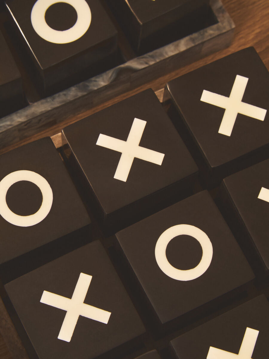 Black and White Noughts and Crosses