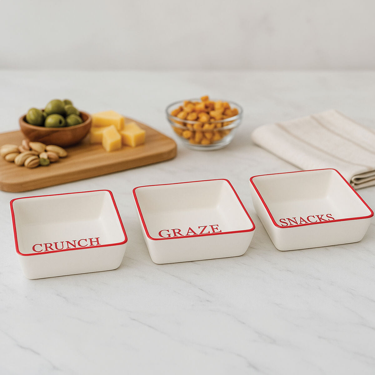 Set of Three Cream Stoneware Snack Dishes with Red Trim