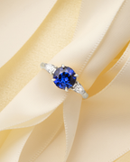 Blue Sapphire Round Cut Three Stone Engagement Ring in Sterling Silver