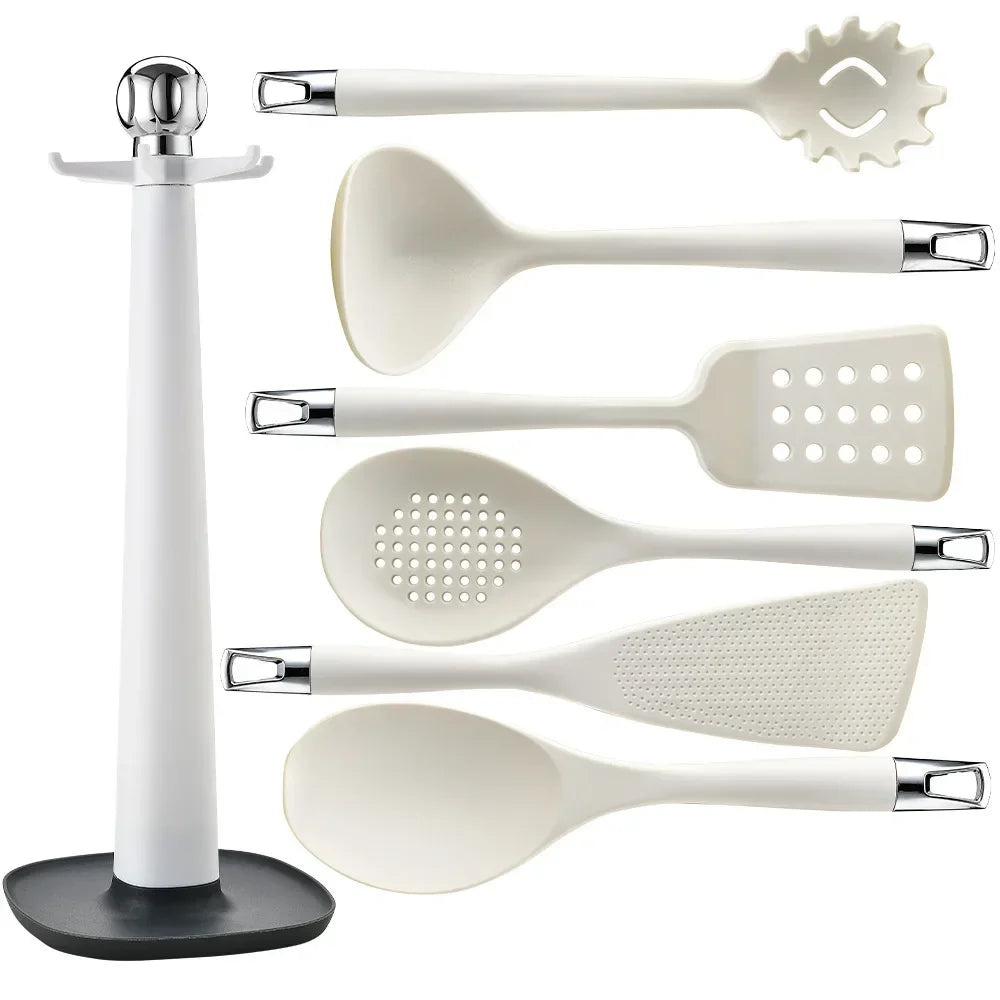 7-Piece Silicone Kitchen Utensils Set with 360° Rotating Countertop Holder – White silicone heads and handles with silver-tone stainless steel hanging hooks/end caps. Heat-Resistant, Dishwasher Safe White